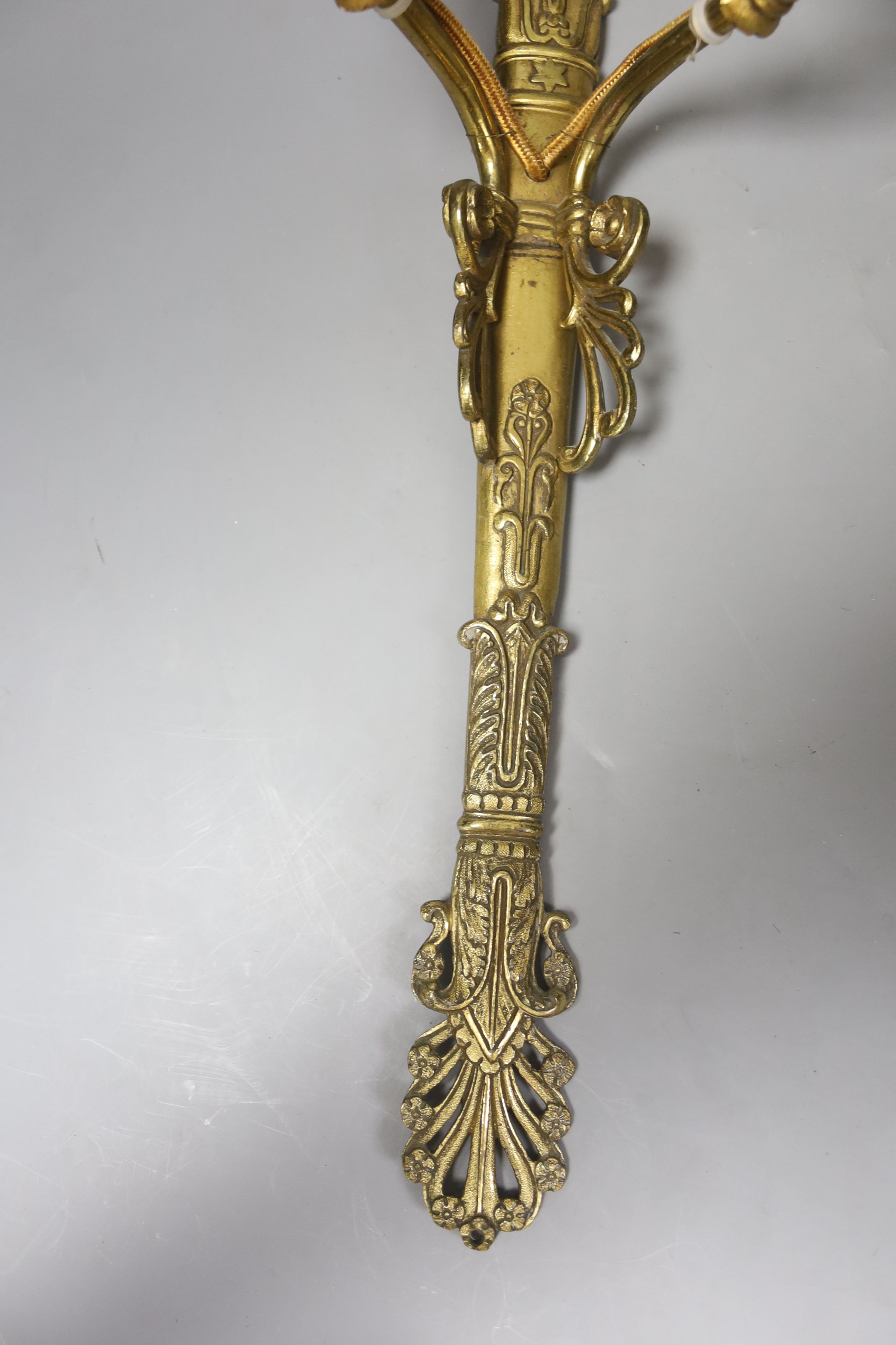 A pair of two branch ormolu wall lights with cherubs, height 42cm